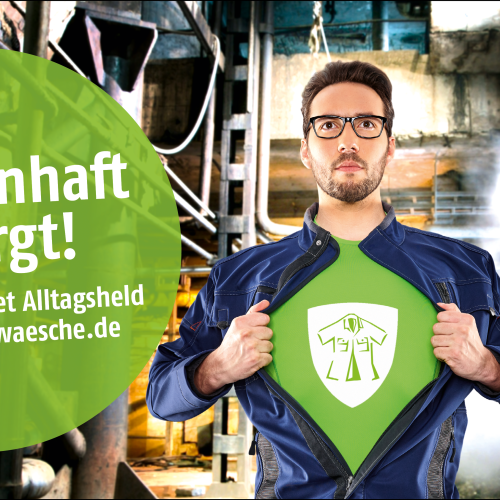 Mann mit Brille, trägt blauen Arbeits-Overall, darunter ein grünes Shirt mit dem diemietwäsche-Logo; Text: Heldenhaft versorgt! Mit dem Paket Alltagsheld von diemietwaesche.de;