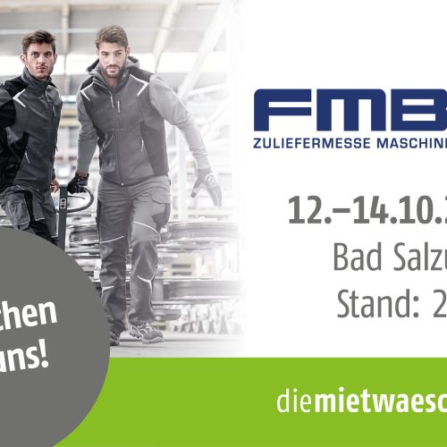 Zwei Männer in Fabrikhalle, die Arbeitskleidung tragen; Teaser für FMB Zuliefermesse Maschinenbau; 12.-14.10.2022 Bad Salzuflen; Stand: 21-B3; Besuchen Sie uns!